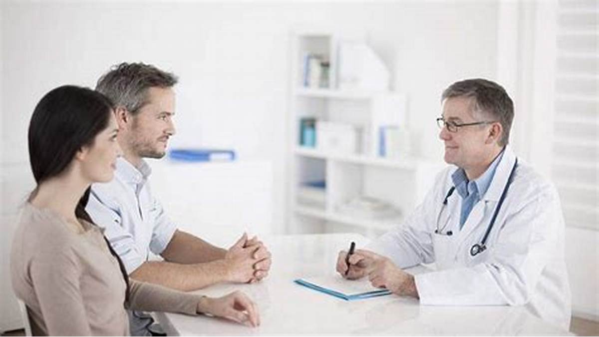 Doctor consulting with two patients